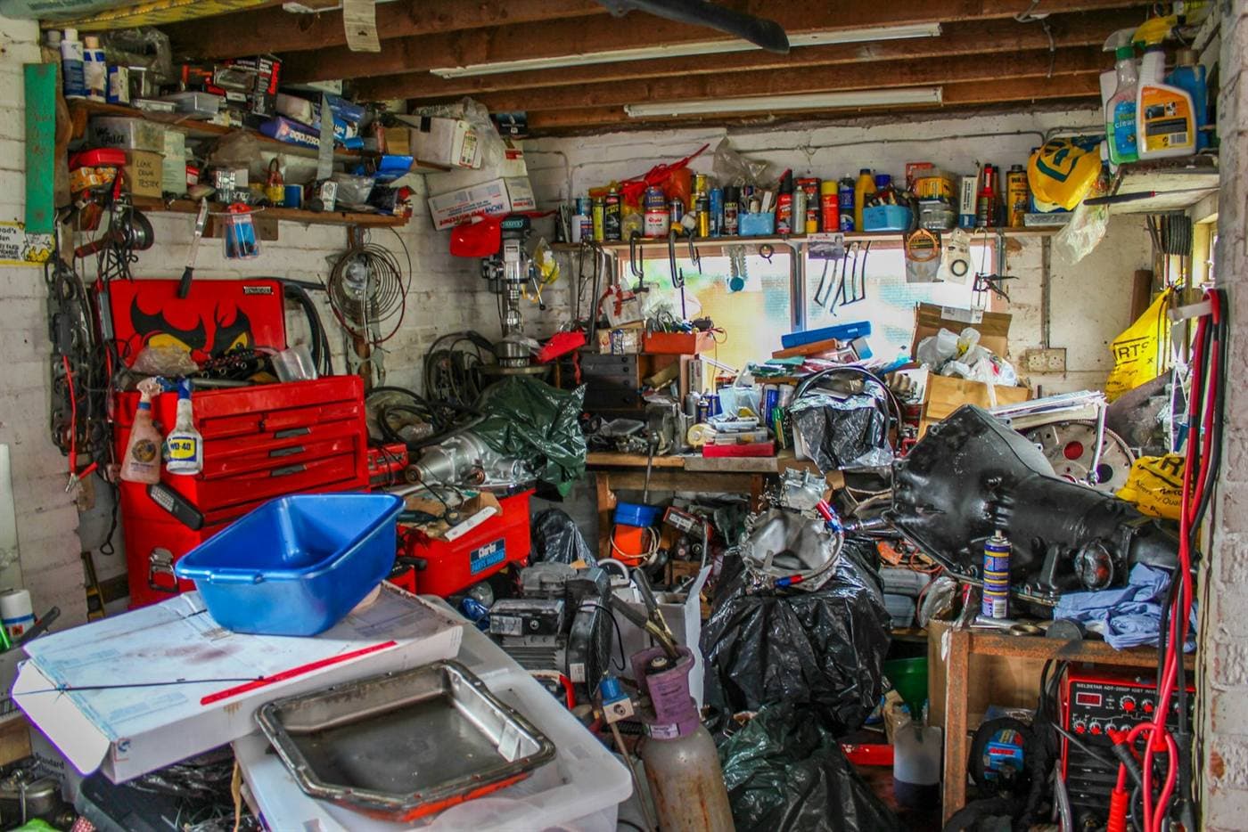 A cluttered garage ready for a clean out